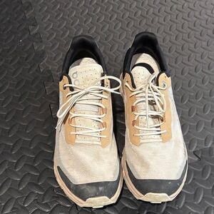 On Running Vista Cream and Black Athletic Shoes